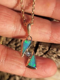 My pieces are handcrafted, and my they reflect a semi rustic feel with their little imperfections.  However, they are made individually and with love :) Beautiful Full solid Multi-color Australian Opal inlay in 14k Gold 29mm long x 10mm wide, Including Bail 2mm moissanite accent. 1.7 Grams Total Weight  (Chain sold separately) Unique Untreated 14k Gold Jewelry, Unique Untreated Yellow Gold Jewelry, Australian Opal Pendant, Australian Opal, Rustic Feel, Opal Pendants, Halloween Shopping, Opal, Jewelry Necklace Pendant