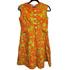 Vtg 1950s Mam'selle Betty Carol Orange/Green Cotton Print Dress Womens Size M?. Good Preowned Condition. No Size Tag. Minor Color Bleed (See Photos). Measurements Chest-18 Inches Length- 36 Inches Waist- 18 Inches Retro A-line Vintage Dress For Garden Party, Retro Vintage Dress For Spring Events, Vintage Orange A-line Dress, Retro A-line Vintage Dress With Vintage Print, Lined Vintage Dress In Retro Style, Vintage Sleeveless Dress With Buttons, Vintage Sleeveless Buttoned Dress, Lined Retro Vintage Dress For Vintage Fashion, Lined Retro Vintage Dress