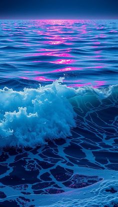 an ocean wave with pink and blue colors