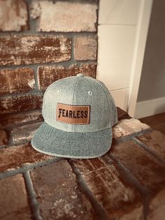 "FEARLESS kids baby/toddler and Kids size Snapback hat. Stylish, durable and high quality for your adventurous little one! Adjustable Snapback style so it will fit them as they grow. Available in Heather Gray, Black or Gray Camo. Features: * Adjustable Snapback style to grow with your child * Stylish and high quality * Faux leather patch * Hand sewn * Ready to ship! * Comfortable and breathable so your kids will love to wear them! Sizing: *On average our hats will fit the age ranges specified be Casual Hat With Logo Patch And Flat Crown, Casual Hats With Logo Patch And Flat Crown, Casual Baseball Cap With Flat Crown, Casual Flat Crown Hats With Logo Patch, Father's Day Casual Adjustable Snapback Hat, Adjustable Flat Bill Baseball Cap, Casual Trucker Hat With Leather Patch, Casual Baseball Cap With Leather Patch, Casual Snapback Hat With Flat Crown For Outdoor