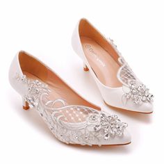 white bridal shoes with lace and beading on the heel, side view in full view