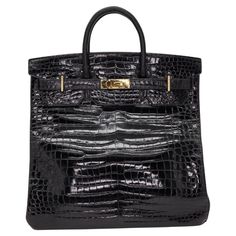 Brand: Hermès Style: HAC Size: 40cm Color: Black Material: Shiny Alligator Hardware: Gold Hardware (GHW) Dimensions: 16" W x 16" H x 9" D Handle Drop: 4.5" Hermes Birkin Handbags, Hermes Style, Birkin Handbags, Global Supply Chain, Jane Birkin, Hermes Handbags, Core Values, Angelina Jolie, Clothing Ideas