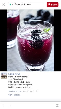 a glass filled with liquid sitting on top of a table