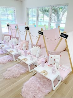 a room filled with lots of pink furniture