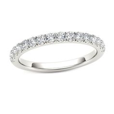 A brilliant celebration of your love, this diamond wedding band is a memory in the making. Crafted in cool 10K white gold, this dazzling look features a row of sparkling diamonds. Shimmering with 3/8 ct. t.w. of diamonds and a bright polished shine, this wedding band honors her. Dazzling White Eternity Band With Brilliant Cut, Dazzling White Brilliant Cut Eternity Band, Classic White Eternity Band For Promise, White Eternity Band With Brilliant Round Cut, Anniversary White Gold Moissanite Eternity Band, Timeless White Half Eternity Wedding Ring, White Moissanite Bridal Sets For Anniversary, Classic White Moissanite Bridal Sets, Wedding Eternity Band In Diamond White With Halo Setting