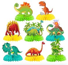 paper cutouts of different dinosaurs and plants