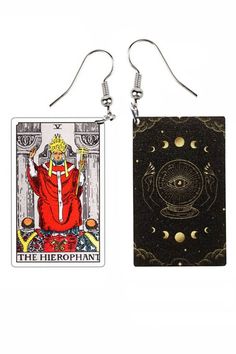 two taroti cards are hanging from earrings