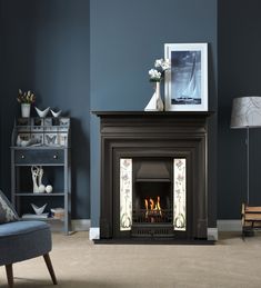 a living room with a fire place in the center and a chair next to it