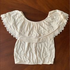 Nwot! Can Be Worn Off The Shoulder Or On The Shoulder :) Cream Cotton Crochet Top, Summer Cotton Tops With Crochet Lace, Summer Short Sleeve Tops With Crochet Trim, Summer Tops With Crochet Trim And Short Sleeves, Cream Cotton Lace Top, Cream Short Sleeve Top With Crochet Trim, Summer Beige Tops With Lace Trim, Summer Cotton Top With Crochet Trim, Summer Cotton Tops With Crochet Trim