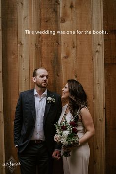 a man and woman standing next to each other in front of a wooden wall with the words, this wedding was one for the books