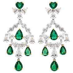 Showcasing a stunning and fashionable pair of chandelier earrings set with mixed cut color-rich green emerald and diamonds in a beautiful chandelier 'shoulder duster' design. Green emeralds weigh 4.23 carats total and diamonds weigh 4.33 carats total, F-H color and VS-SI in clarity. Finely made in 18k white gold. 44.25mm in length and 19.94mm in width. Style available in different price ranges. Prices are based on your selection. Please contact us for more information. Roman Malakov is a custom house, specializing in creating anything you can imagine. If you would like to receive a special quote on a custom piece please message or call us. Special Quotes, Beautiful Chandelier, Green Gems, Dream Jewelry, Emerald Green, Chandelier Earrings, Cut And Color, Earring Set, Emerald