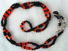 Orange & Black Beaded Eyeglass Chain - Juicybeads Jewelry Black Glass Beaded Necklaces With Colorful Beads, Black Glass Beaded Necklace With Colorful Beads, Black Glass Beaded Necklaces With Beaded Chain, Black Glass Beaded Necklace With Beaded Chain, Handmade Black Plastic Jewelry, Black Jewelry With Colorful Czech Glass Beads, Adjustable Czech Glass Beaded Necklaces With Lobster Clasp, Black Glass Beaded Necklace, Adjustable Black Czech Glass Jewelry