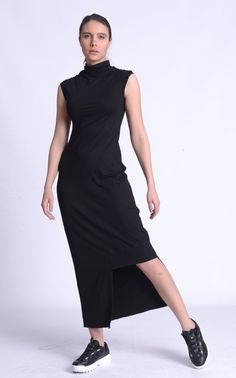 Black Asymmetric Mock Neck Dress - METD0169 Treat yourself with a cool new dress that is not only extravagant and daring but very practical and suitable for all day wear. This long fitted dress has a statement asymmetry detail which reveals one leg. The top part has a mock neck and cap sleeves for a more feminine and gentle look. It is super easy to wear as you just slide it on like an oversize pullover and boom - you are ready! What is a great plus for this piece is the fact that is can be worn Long Fitted Dress, Long Fitted Dresses, Oversize Pullover, Pull Oversize, Mock Neck Dress, Hooded Raincoat, More Feminine, Oversized Pullover, Look Plus