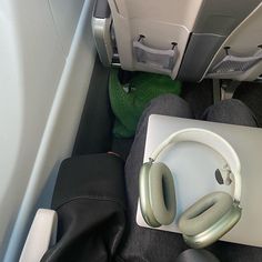 an airplane seat with headphones on it