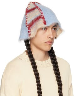 Shag knit bucket hat in tan, blue, and red. · Stripes, stitching, and exposed seams throughout · Paneled construction Supplier color: Tan Crazy Crochet Hats, Red Crochet Hat, Weird Hats, Mohair Hat, Knit Bucket Hat, Fashion Factory, Striped Hat, Exposed Seams, Knitting Machine