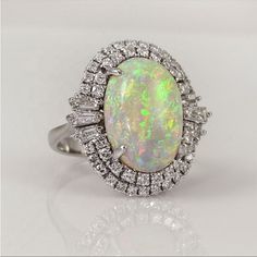 Simulated Opal 925 Stamped Formal Oval Opal Ring In White Gold, Formal Oval White Gold Opal Ring, Luxury Sterling Silver Oval Opal Ring, White Gold Opal Ring Fine Jewelry, Formal Silver Opal Ring With Center Stone, Formal Oval Opal Ring In Sterling Silver, Formal White Gold Opal Ring In Fine Jewelry Style, Formal White Gold Opal Ring, Fine Jewelry Style, Silver Opal Ring For Formal Occasions