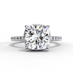 an oval cut diamond ring with pave set shoulders