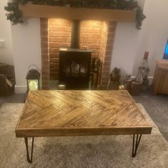 a wooden table sitting in front of a fire place