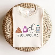 a t - shirt that says squadgoals on the front and back with an image of doughnuts