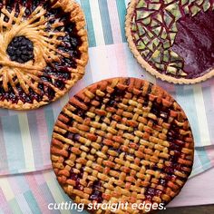 three pies sitting on top of a table next to each other