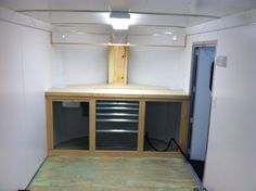 the inside of a storage room with drawers and shelves on each side that are built into the wall