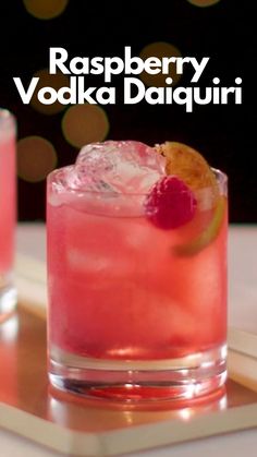 the raspberry vodka daiquiri is garnished with an orange slice