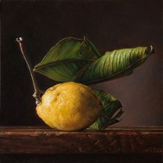 an oil painting of a lemon and green leaves on a wooden table with a dark background