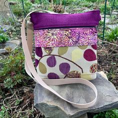 "Vegan crossbody or shoulder bag makes a wonderful everyday bag. Textured Upholstery Tapestry looks Handwoven..Industrial Strength Upholstery Tapestry accented with Batik . This bag is loaded with pockets! The outside has one deep zipper, one shallow(for your phone?)zipper, and one deep open pocket. Top zip opens to roomy interior with 4 more smaller pockets. Inside fits an iPad mini. Strap is sturdy web material and adjustable to shoulder bag or crossbody length. Great as a travel purse-very li Purple Shoulder Bag With Zipper Pocket, Purple Crossbody Bag With Zipper Pocket, Fabric Bag With Cell Phone Pocket For Everyday Use, Fabric Bags With Cell Phone Pocket For Everyday Use, Travel Fabric Bag With Zipper Pouch, Fabric Crossbody Travel Bag, Fabric Shoulder Bag With Zipper Pocket For Travel, Fabric Shoulder Bag With Zipper Pocket, Beige Fabric Shoulder Bag With Adjustable Strap