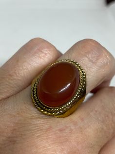 Vintage Genuine Red Carnelian golden Bronze Ring Size 8.5 can be re sized to any size if you request it. There is a $20 jeweler's fee All rings are shipped in a nice gift box. Check out our over a THOUSAND great reviews Engraving is $4 per letter and is not always perfect depending on the piece. It can take a few days if the jeweler is busy. This is payable to Paypal Judithsltd@gmail.com Carnelian Ring For Formal Occasions, Formal Carnelian Gold Ring, Formal Gold Carnelian Ring, Formal Carnelian Ring, Oval Ruby Ring As Gift, Vintage Carnelian Ring For Formal Occasions, Vintage Oval Cabochon Ring As Gift, Oval Carnelian Gold Jewelry, Gold Carnelian Ring For Anniversary