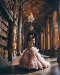 a woman in a pink dress is standing in an old library