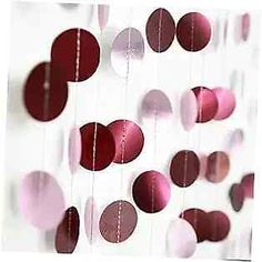 some red and pink circles hanging from strings