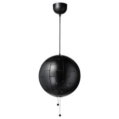 a black ball hanging from a metal pole