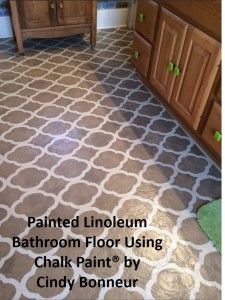 a bathroom floor that has been painted brown and white