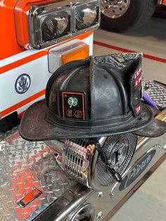 a fireman's hat sitting on top of a truck