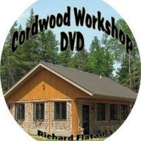 the logo for redwood workshop dvd, which is located in front of a log cabin