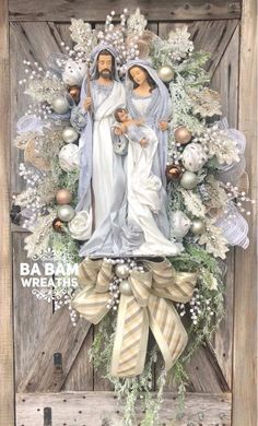 a christmas wreath with jesus and mary on it