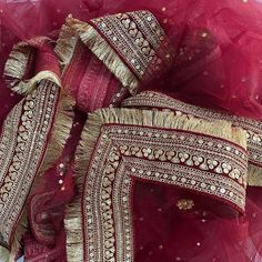 This gorgeous Bridal Queen Maroon Stone Embroidered Fringed Net Dupatta comes with a traditional and festive Maroon tone just like Katrina Bridal Dupatta. To enhance this, a detailed and fine thread and sequin border on silk with dainty fringes on the edges. Look like a queen wearing the Bridal Dupatta worn by Katrina at her wedding with this net stone work embroidered dupatta from anokherang. Material : Net Work type : Stone, Sequin Pattern Type : Embroidered with Fringes Color : Maroon Length Chunni Designs, Bridal Dupatta Designs, Duppattas Designs Ideas, Dupatta Design, Heavy Dupatta, Bridal Dupatta, Sequin Pattern, Indian Bride Outfits, Fancy Sarees Party Wear