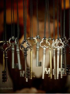 an assortment of keys hanging from hooks