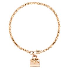 Stylish Hermes Birkin Amulette diamond bracelet in 18 karat gold. This delicate chain bracelet is part of Hermes popular Amulettes collection and features a delightful Birking bag shaped charm. The bracelet glows with radiance of high-polish rose gold and features a sparkling round brilliant diamond hanging off the bag in the manner of famous Hermes bag charms. Enchanting clasp is designed as a Birkin bag lock with inserted key. Hermes does not make the Birkin version of this bracelet any longer Bag Lock, Style Français, Moda Paris, Hermes Box, Bag Charms, Delicate Chain, Famous Fashion, Tres Chic, Hermes Bag