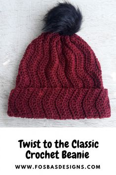 the twist to the classic crochet beanie with a black pom - pom