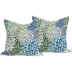 two pillows with blue and green flowers on them