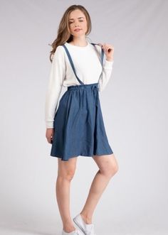 This adorable overall skirt is the perfect comfy, casual piece! It has a cinched waist with a tied string in the front, and an A-line cut skirt. Model is wearing a small. 100% rayon *Free shipping & returns on orders over $50! Casual Spring Suspender Dress With Tie Straps, Casual Spring Suspender Dress For Day Out, Casual Mini Suspender Dress For Day Out, Casual Suspender Dress For Dress Down Occasions, Casual Drawstring Sundress For Day Out, Casual Sundress With Drawstring For Day Out, Casual Tie Waist Skirt For A Day Out, Casual Mini Pinafore Dress For Spring, Spring Casual Mini Pinafore Dress