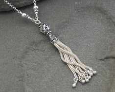 "This necklace features a Turkish Sterling Silver Filigree Tassel securely wire wrapped to a long sterling chain. I added some coordinating Turkish and sterling silver beads into the wire wraps for an extra accent. This tassel necklace is classic, elegant and fun. Can easily be dressed up or worn casually. The chain measures 30\" and the pendant hangs about 3\" from that. No clasp necessary as the long chain fits right over your head. Sterling Silver is .925 pure silver. Bali silver is .925 pure Geode Earrings, Layered Necklaces Silver, Bali Silver, Silver Chain Style, Tassel Jewelry, Chain Silver, Sterling Silver Filigree, Layering Necklace, Classic Elegant