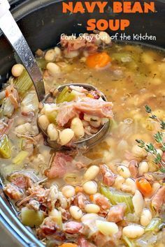 a spoon full of soup with beans and ham