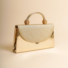 The sides and chain strap of this wedding clutch bag made of faux leather and glitter fabric are gold colored. Basic make-up supplies, cell phone, key chain, credit card and money can easily fit into this luxury mini bag. The interior of this evening bag has a single compartment and is lined with suede. It has a 120 cm removable chain strap. This wedding clutch is completely handmade. Features: Faux leather and glitter fabric. Fits basic makeup, cell phone, key chain, credit card and money. Suede lined and single compartment. 120 cm removable chain strap. The sides and chain strap are silver. It is completely handmade. Size: Width: 24 cm (9,4 inches) Lenght: 14 cm (5,5 inches) Depth: 5 cm (1.9 inches) Strap: 120 cm (47 inches) Cream, perfume, alcohol, bleach etc. Avoid contact with substan Luxury Mini Bag, Gold Clutch Purse, Gold Clutch Bag, Formal Bag, Formal Clutch, Gold Evening Bag, Evening Accessories, Glitter Clutch, Clutch Bag Wedding