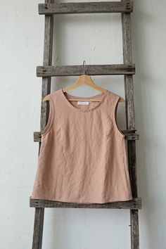 Sleeveless shirt is made from 100% soft and washed linen. Details: - Colour: Dusty rose - Composition: 100% Oeko-Tex certified linen - A line style - Medium weight linen - Linen care: machine wash gentle; tumble dry low, ironing optional - The price is for one shirt, other pictured items are not included Sleeveless Linen Top For Everyday, Flax Sleeveless Top For Spring, Sleeveless Flax Tops For Spring, Spring Sleeveless Flax Tops, Sleeveless Linen Blouse In Relaxed Fit, Sleeveless Flax Summer Tops, Spring Linen Tank Blouse, Linen Tank Blouse For Spring, Spring Flax Sleeveless Top