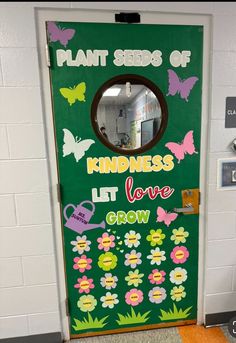 a door decorated with flowers and butterflies for the plant seeds of kindness love grow