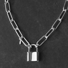 This classic Sterling Silver Padlock and Paperclip Chain Necklace has been crafted from high quality Italian sterling silver that will last a lifetime. Featuring a padlock pendant as the clasp, it's the perfect statement necklace for any look. Details: Chain: Solid Italian Sterling Silver Paperclip chain, 6mm Clasp: Sterling Silver working padlock clasp, 20x15mm Sizes: 16 inches to 36 inches Shipping: Ready to ship within one business day Complimentary shipping in the USA Complimentary gift wrap Padlock Necklace, Paperclip Chain Necklace, Personalized Pendant, Chain Necklaces, Paper Clip, Cable Chain, Men Necklace, Solid 925 Sterling Silver, Chain Link