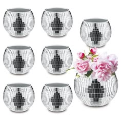 a set of six silver vases with pink flowers in them on a white background