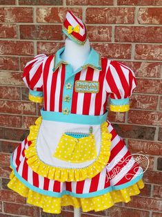 a red and white striped dress with yellow polka dots